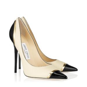 Women cream pointed pumps with black cap toe and gold accent